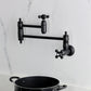 Kingston Brass KS3103PKX Duchess Wall Mount Pot Filler Faucet, Antique Brass with porcelain handles