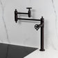 Kingston Brass KS3703CG Fuller Deck Mount Pot Filler Faucet, Antique Brass installed in a stylish kitchen setting.