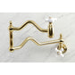 Kingston Brass KS2107PX Heritage Wall Mount Pot Filler Faucet, Brushed Brass on a marble surface