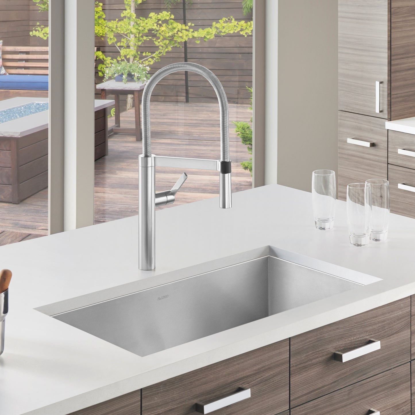 BLANCO Quatrus R0 32" Single Bowl Undermount Stainless Steel Kitchen Sink with modern faucet in stylish kitchen setting.