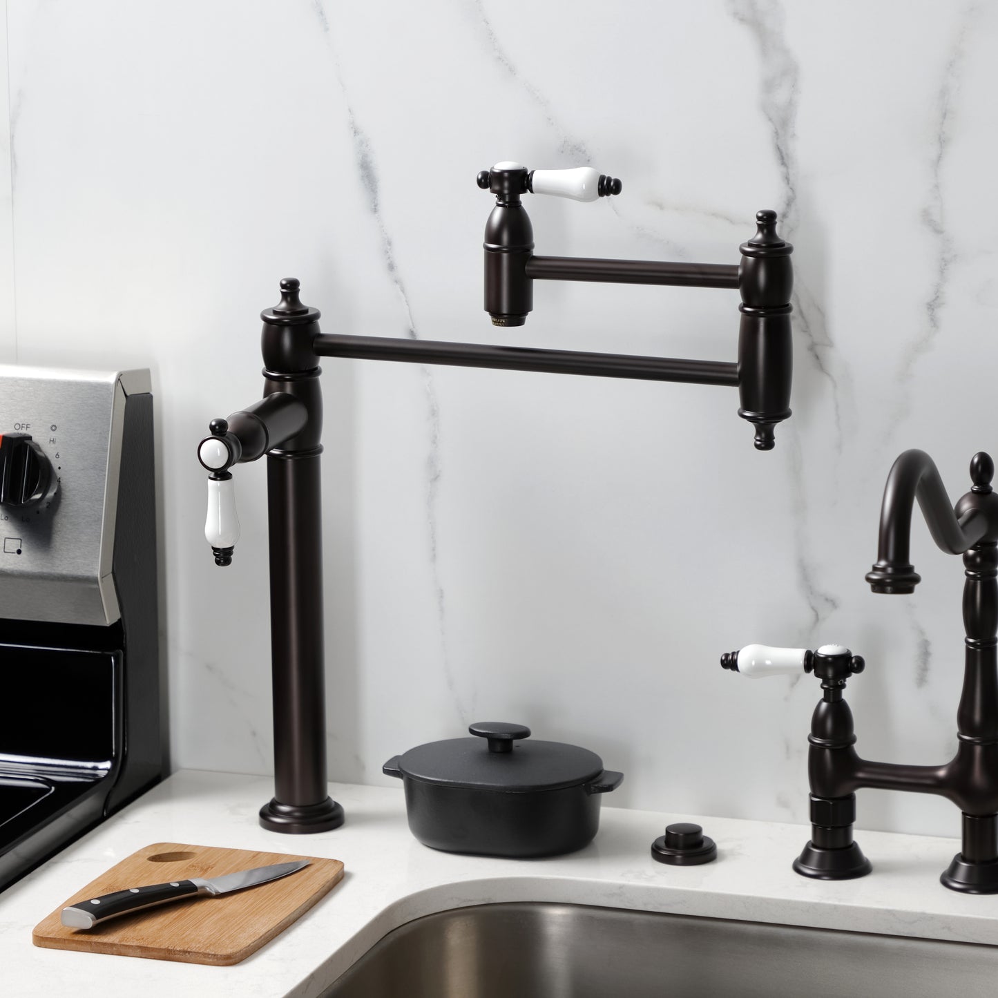 Kingston Brass KS3703BPL Bel-Air Deck Mount Pot Filler Faucet, Antique Brass on a countertop with kitchen utensils.