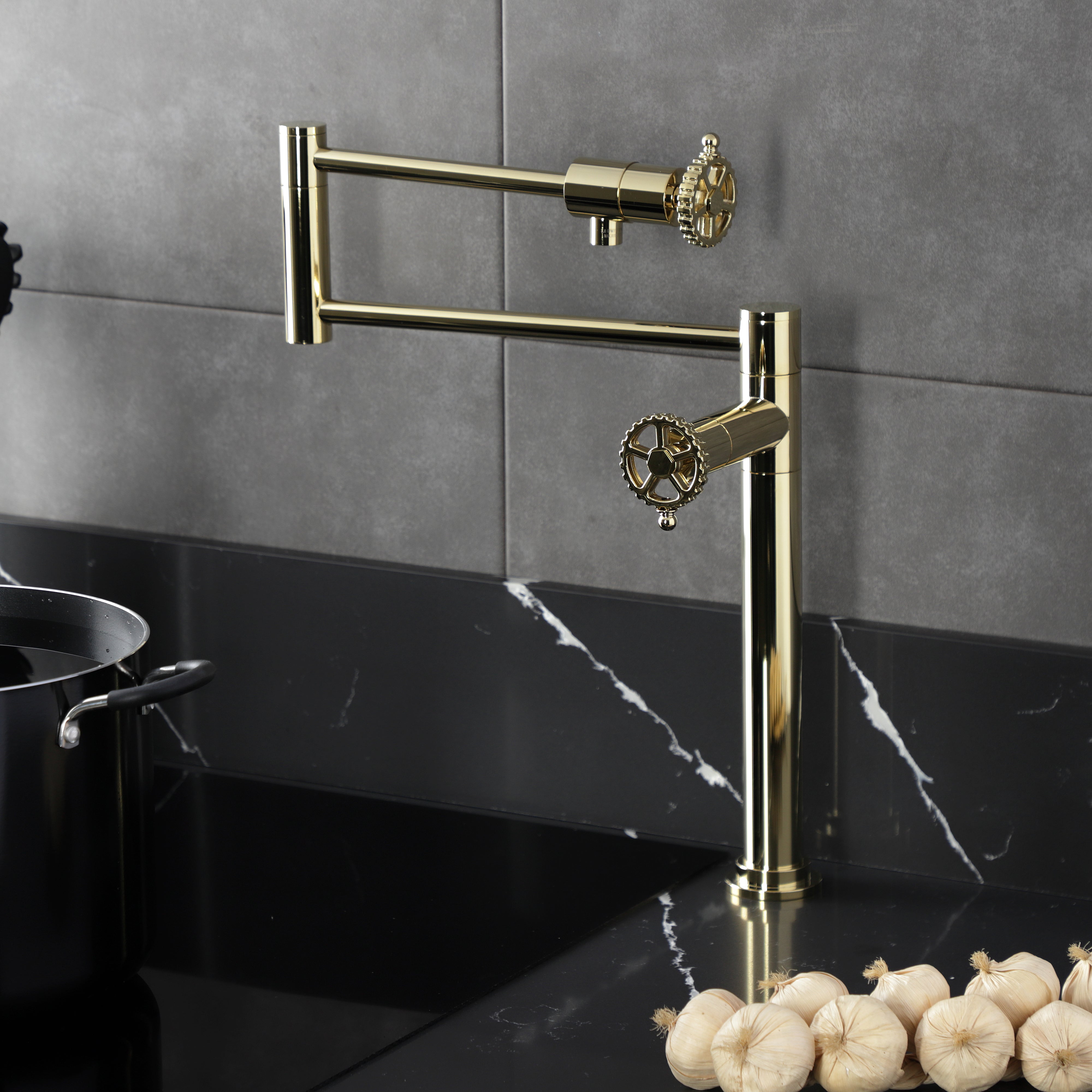 Kingston Brass KS4703CG Fuller Deck Mount Pot Filler Faucet, Antique Brass installed over a black marble countertop.