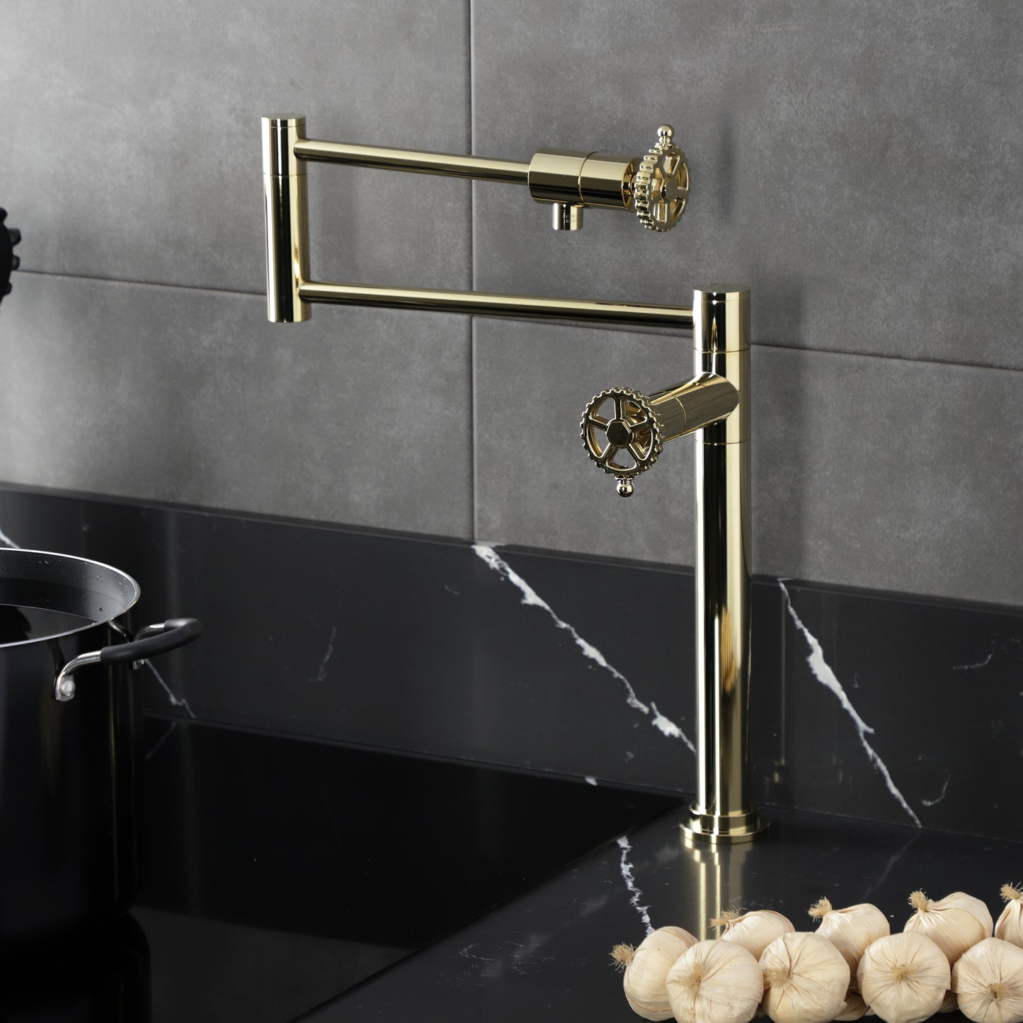 Kingston Brass KS4703CG Fuller Deck Mount Pot Filler Faucet, Antique Brass installed over a black marble countertop.