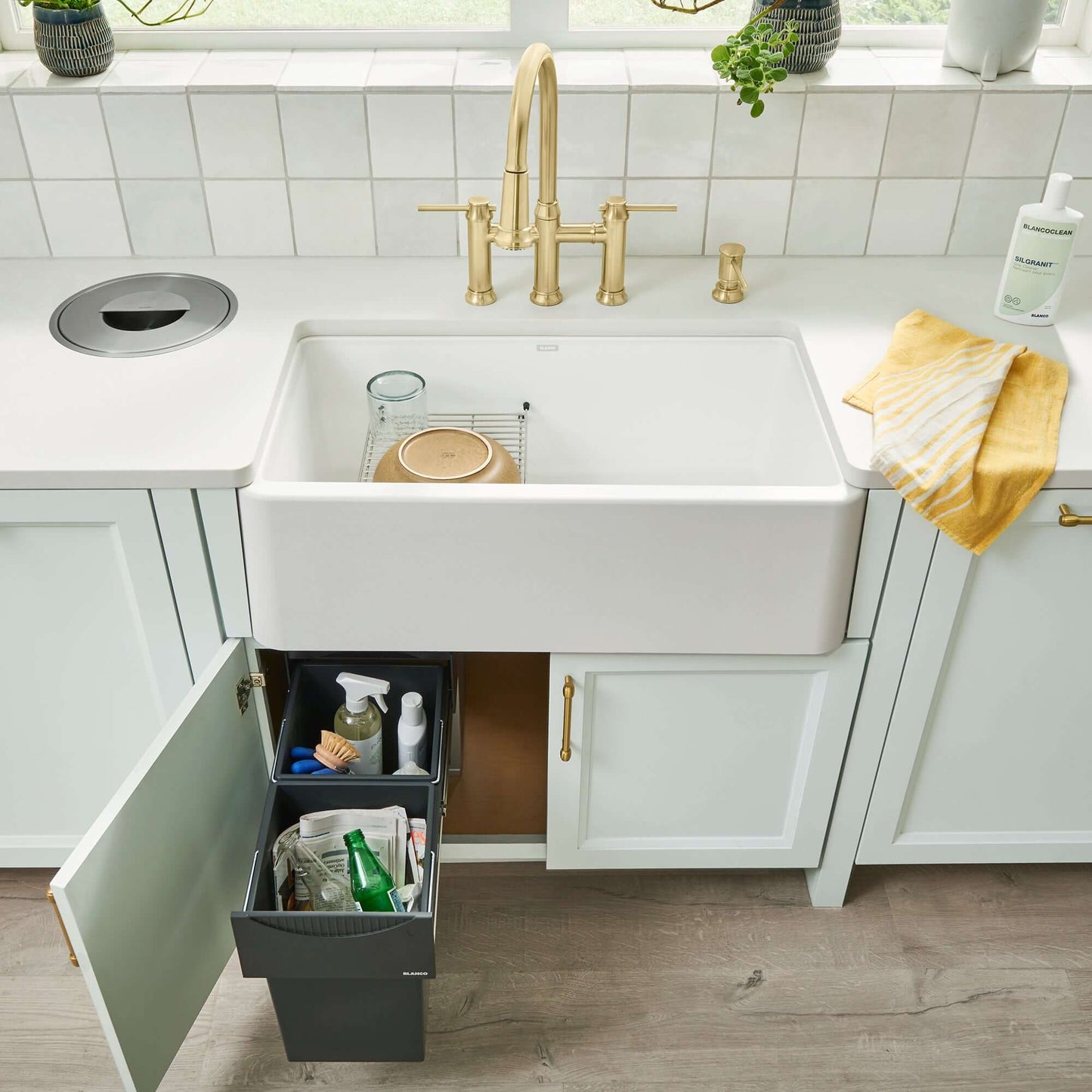 BLANCO Ikon SILGRANIT 33" Single Bowl Apron-Front Farmhouse Sink with modern faucet and pull-out storage.