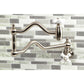 Kingston Brass KS2107PX Heritage Wall Mount Pot Filler Faucet, Brushed Brass on a modern tile backsplash.