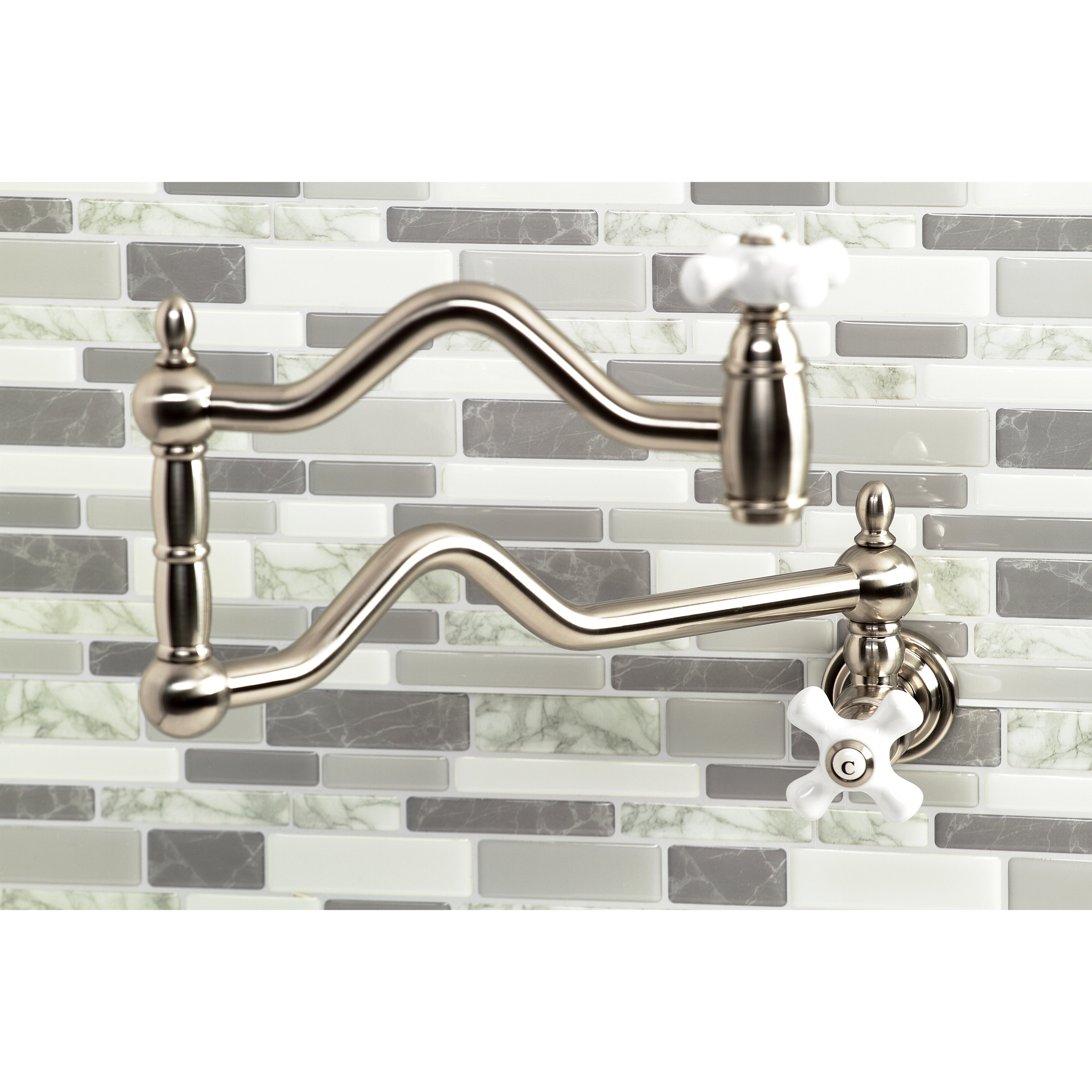 Kingston Brass KS2107PX Heritage Wall Mount Pot Filler Faucet, Brushed Brass on a modern tile backsplash.