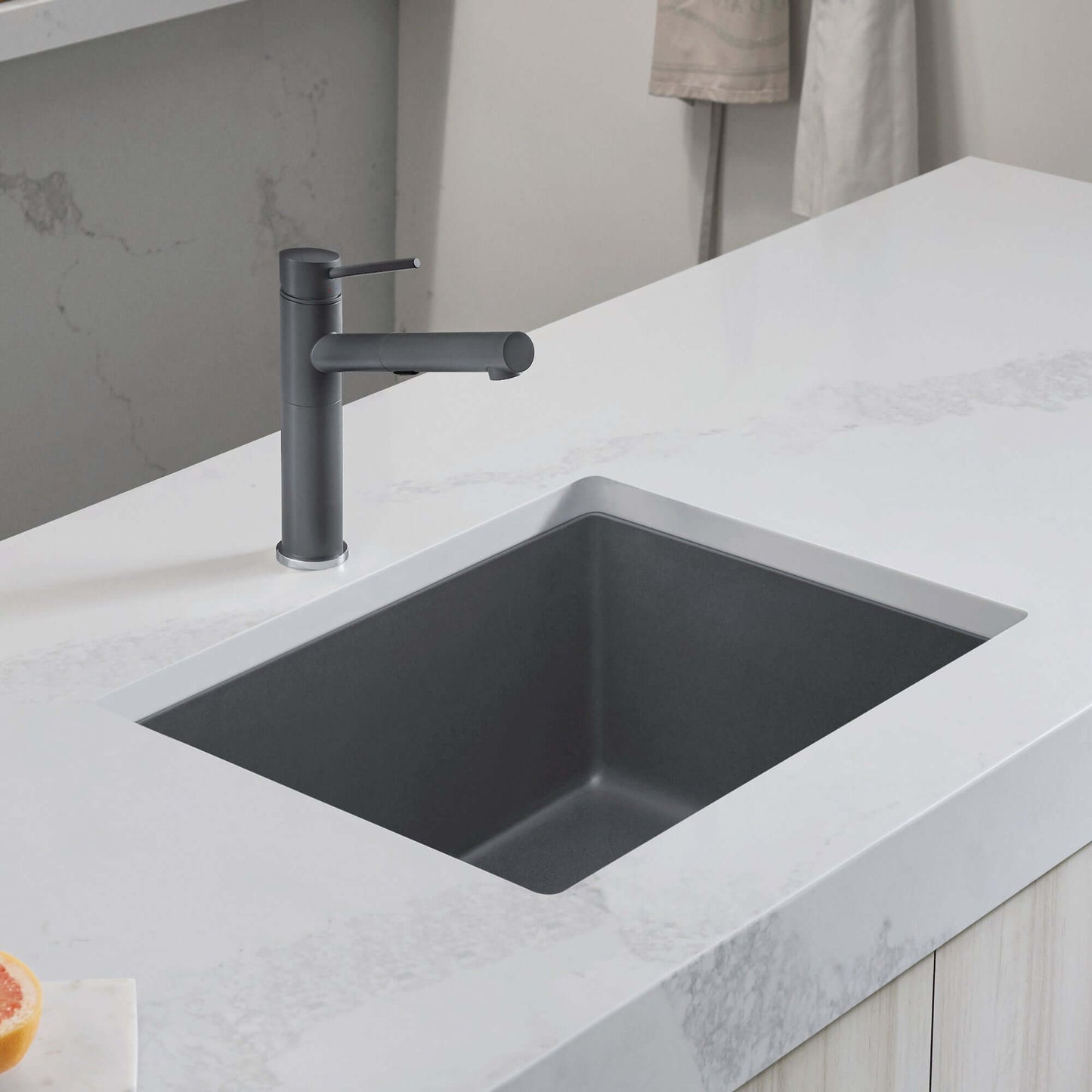BLANCO PRECIS 24" SILGRANIT Compact Undermount Sink with modern faucet on white countertop