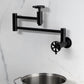 Kingston Brass KS8103RX Belknap Wall Mount Pot Filler Faucet, Antique Brass in modern kitchen setting