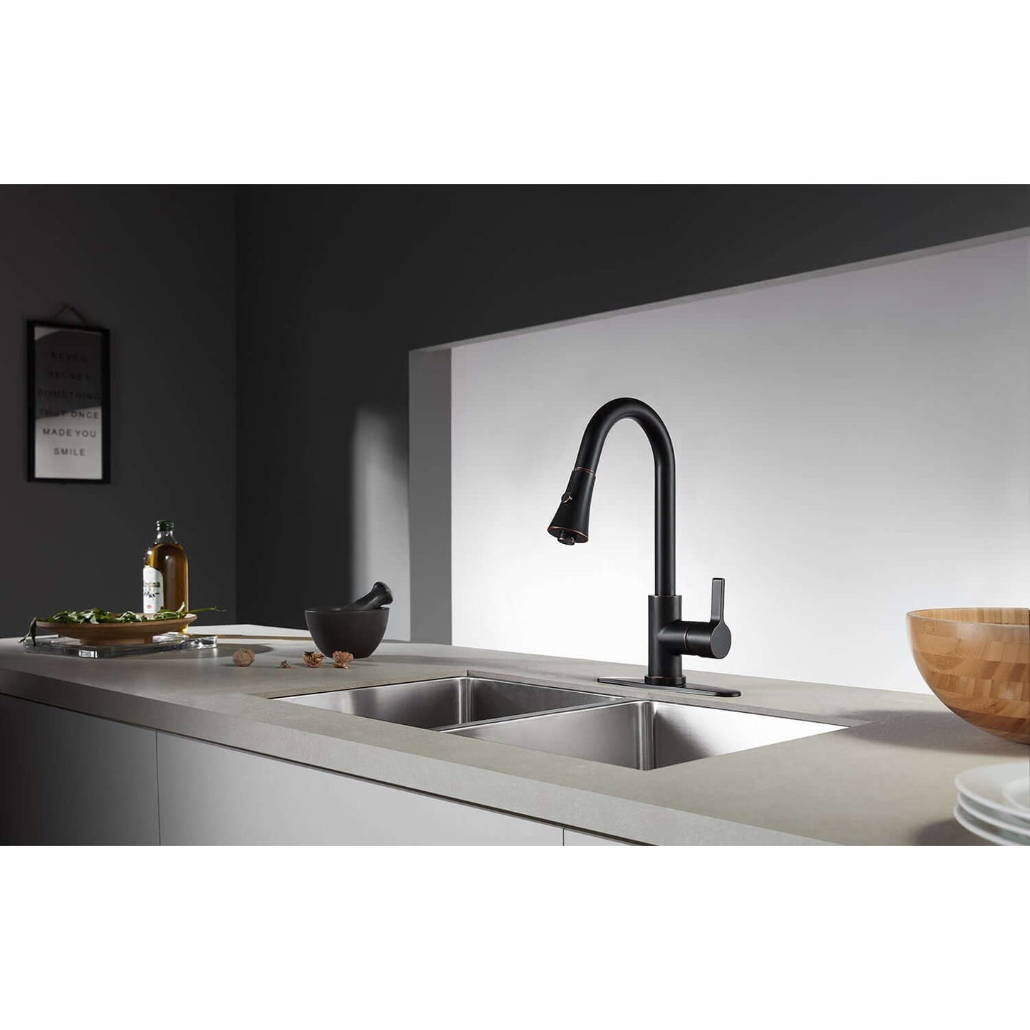 Kingston Brass LS8723CTL Continental Pull-Down Kitchen Faucet in sleek black design, viewed from the left side in a modern kitchen setting.