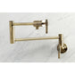 Kingston Brass KS4103ML Milano Wall Mount Pot Filler Faucet, Antique Brass close-up view on marble background