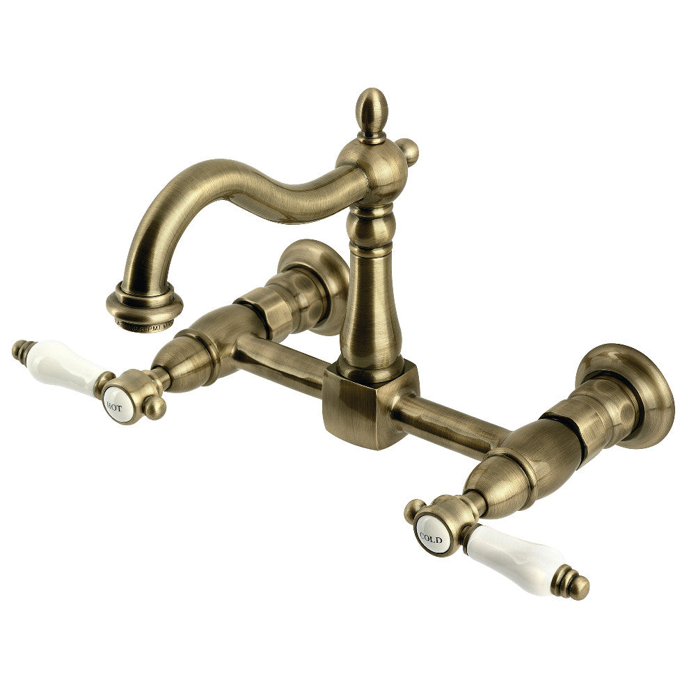 Kingston KS1263BPL Bel-Air Two-Handle Wall Mount Bridge Kitchen Faucet, Antique Brass with white porcelain levers