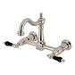 Kingston KS1263PKL Duchess Two-Handle Wall Mount Bridge Kitchen Faucet, Antique Brass with black porcelain handles.