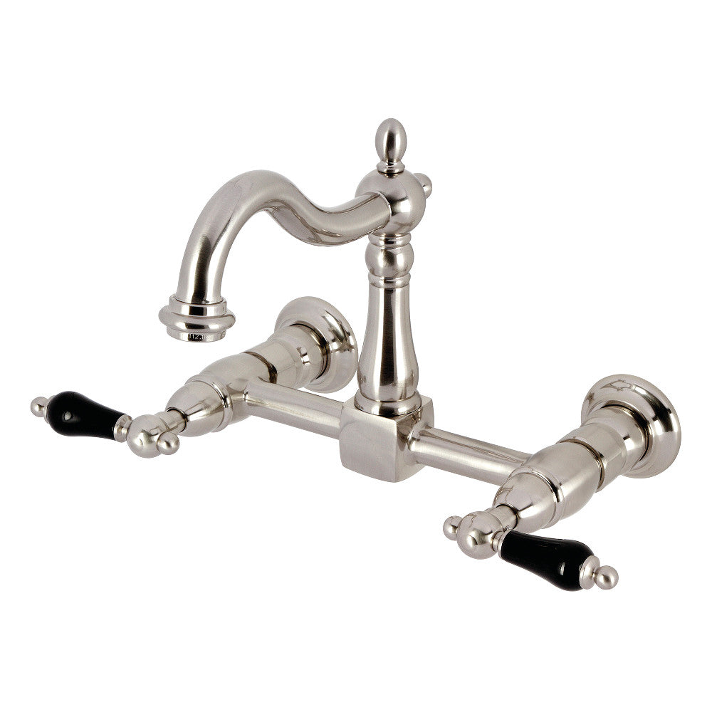 Kingston KS1263PKL Duchess Two-Handle Wall Mount Bridge Kitchen Faucet, Antique Brass with black porcelain handles.