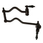 Kingston Brass KS2107PKL Duchess Wall Mount Pot Filler Faucet, Brushed Brass with black porcelain handles.