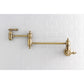 Kingston Brass KS3103AL Restoration Wall Mount Pot Filler Faucet, Antique Brass mounted on wall.