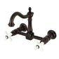 Kingston KS1263PX Heritage Two-Handle Wall Mount Bridge Kitchen Faucet, Antique Brass with white ceramic handles.