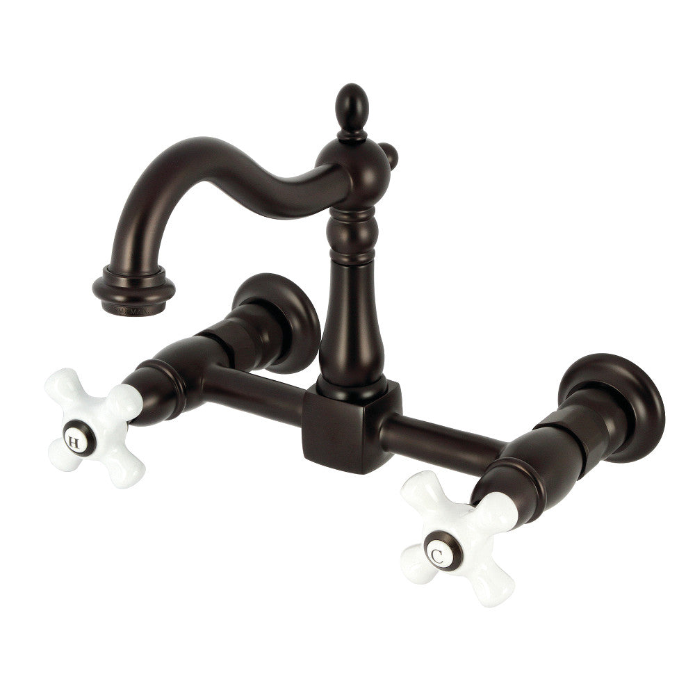 Kingston KS1263PX Heritage Two-Handle Wall Mount Bridge Kitchen Faucet, Antique Brass with white ceramic handles.