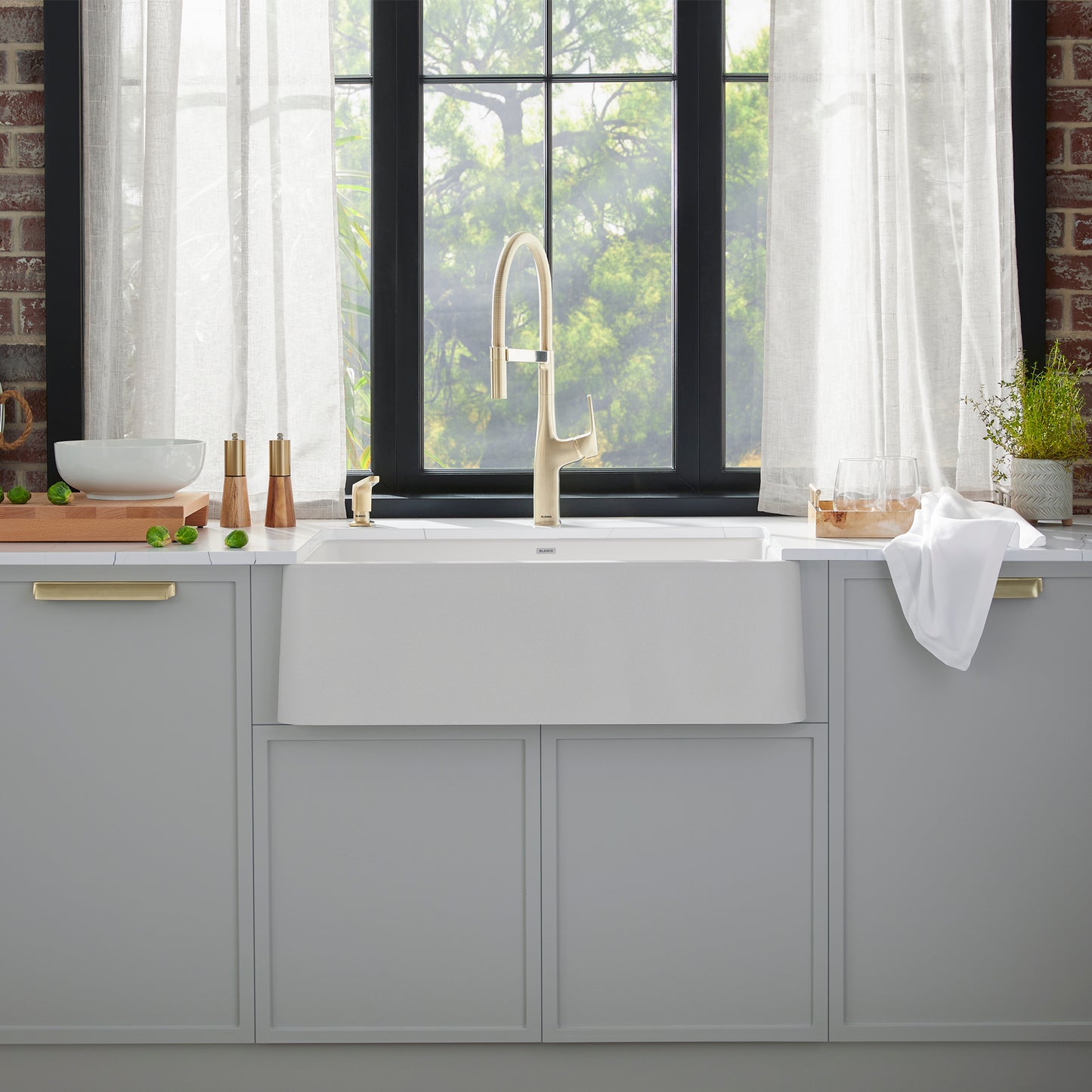 BLANCO Ikon SILGRANIT 30" Single Bowl Apron-Front Farmhouse Sink in modern kitchen with stylish decor.