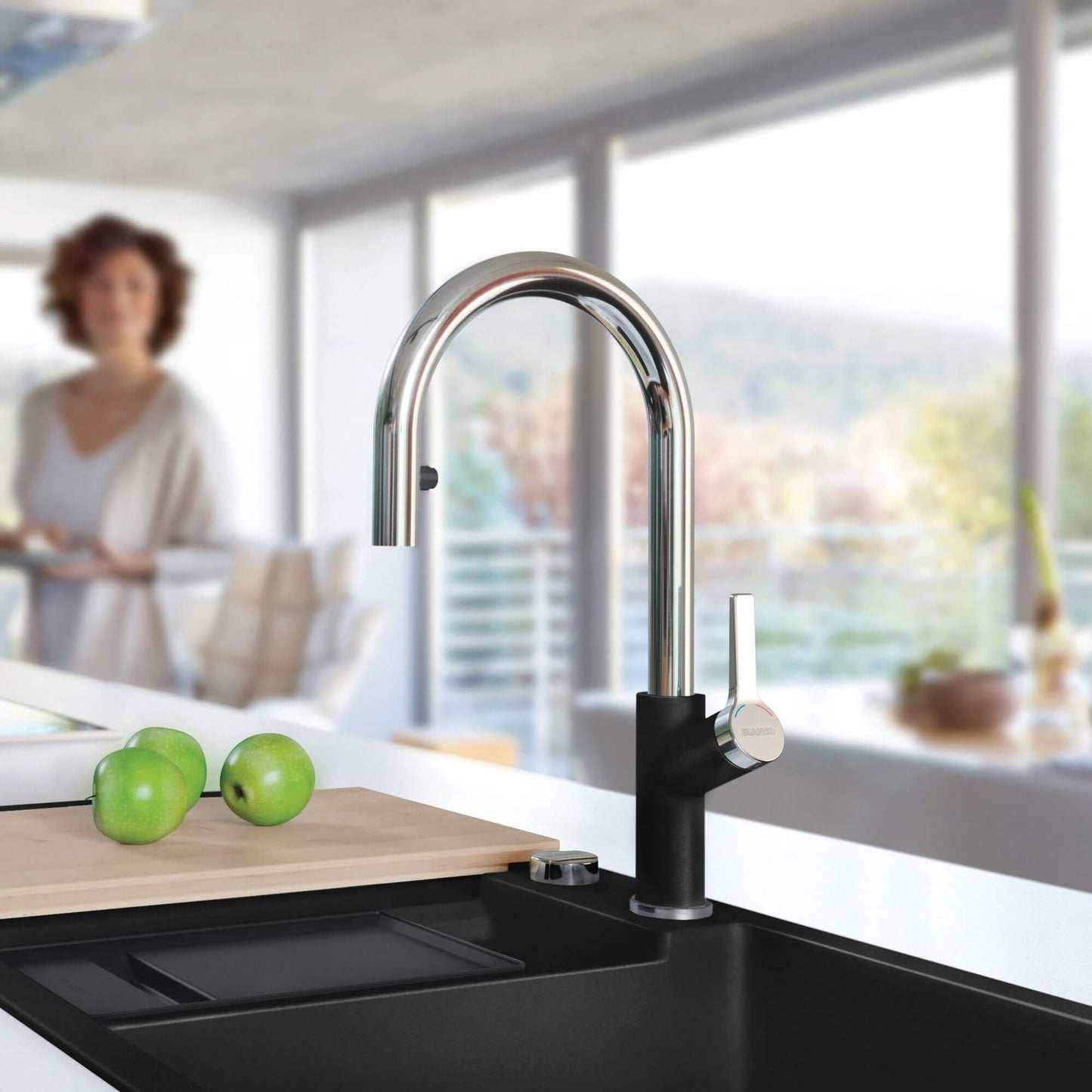BLANCO Urbena Pull-Down Dual-Spray Kitchen Faucet in modern kitchen setting with apples on countertop.