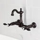 Kingston KS2443TAL Tudor Two-Handle Wall Mount Bridge Kitchen Faucet, Antique Brass design on marble background