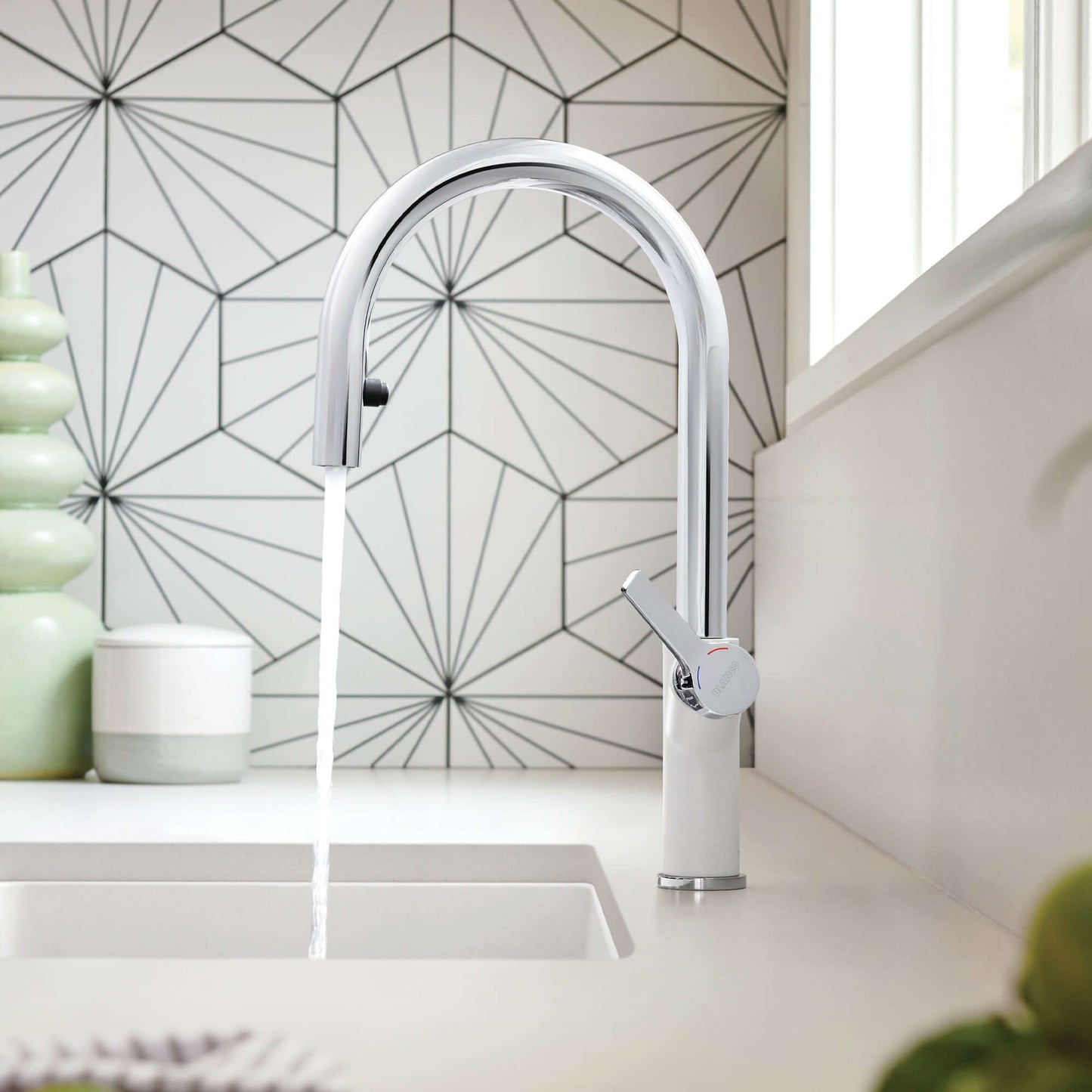 BLANCO Urbena Pull-Down Dual-Spray Kitchen Faucet in modern kitchen setting with geometric tile and water flow.