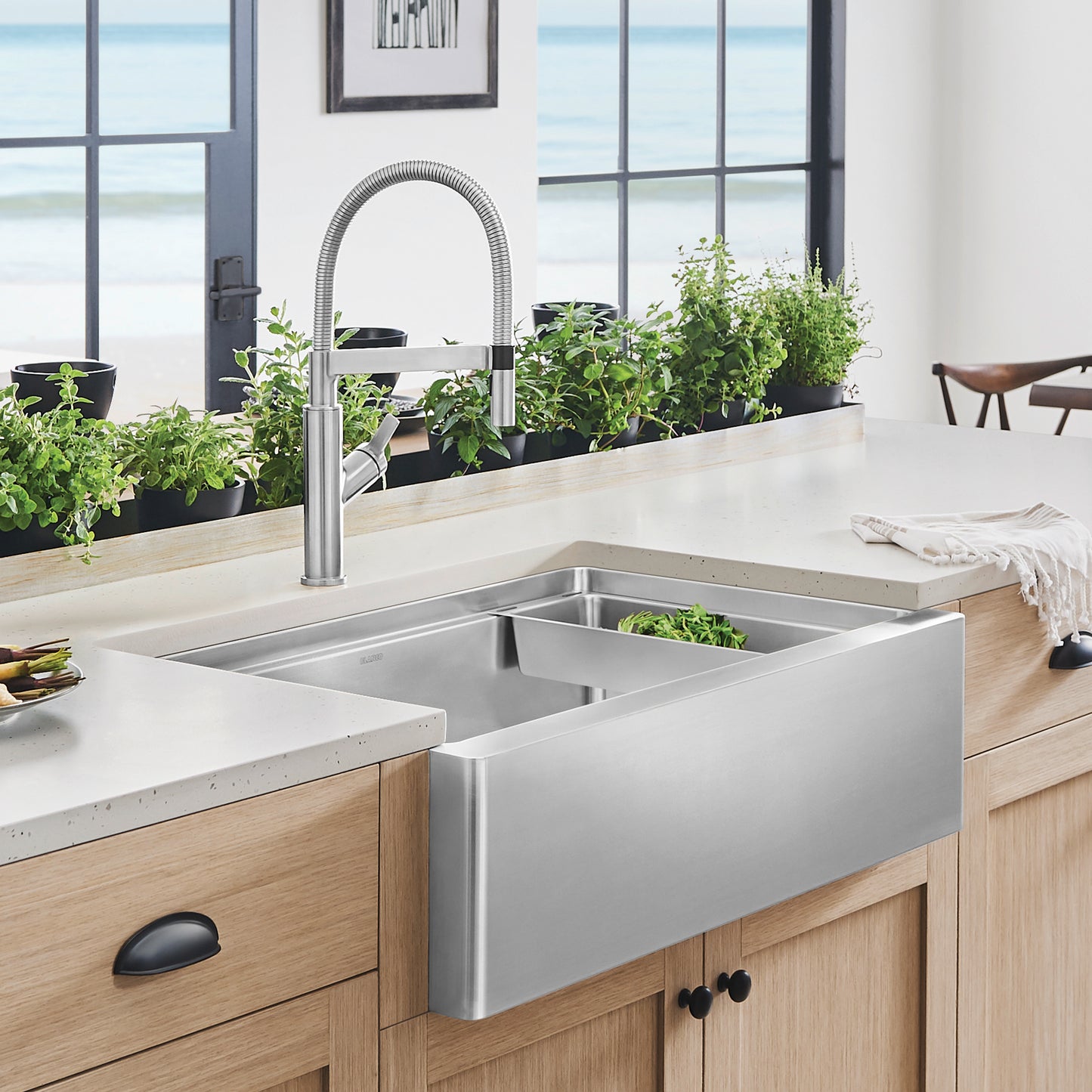 BLANCO Quatrus R15 Ergon 33" Single Bowl Apron-Front Stainless Steel Farmhouse Sink in modern kitchen setting.