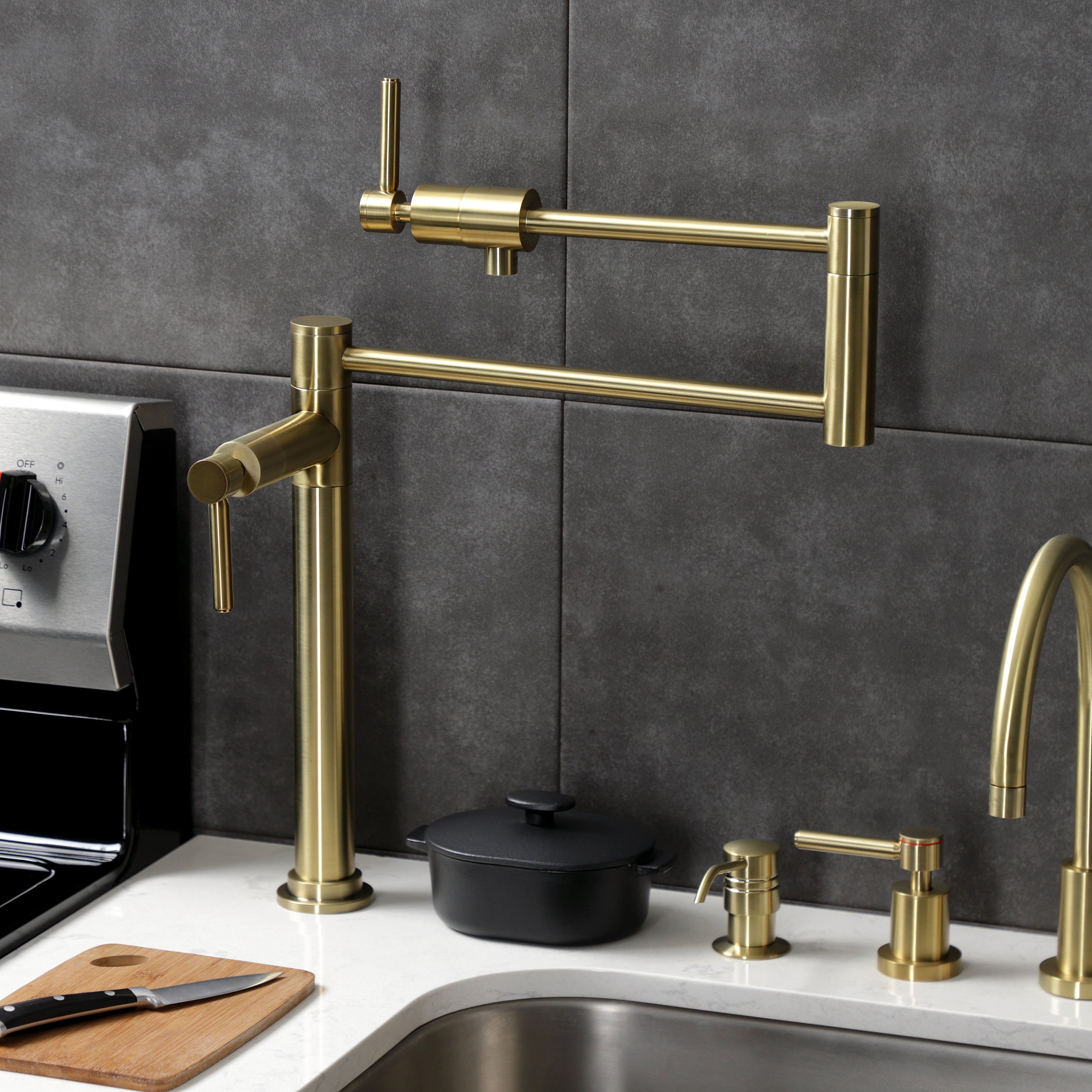 Kingston Brass KS4703DL Concord Deck Mount Pot Filler Faucet, Antique Brass in a kitchen setting with modern design.