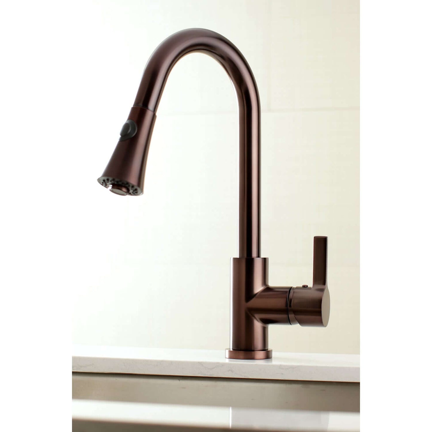 Kingston Brass LS8723CTL Continental Pull-Down Kitchen Faucet with curved spout, angled left side view for modern kitchen.
