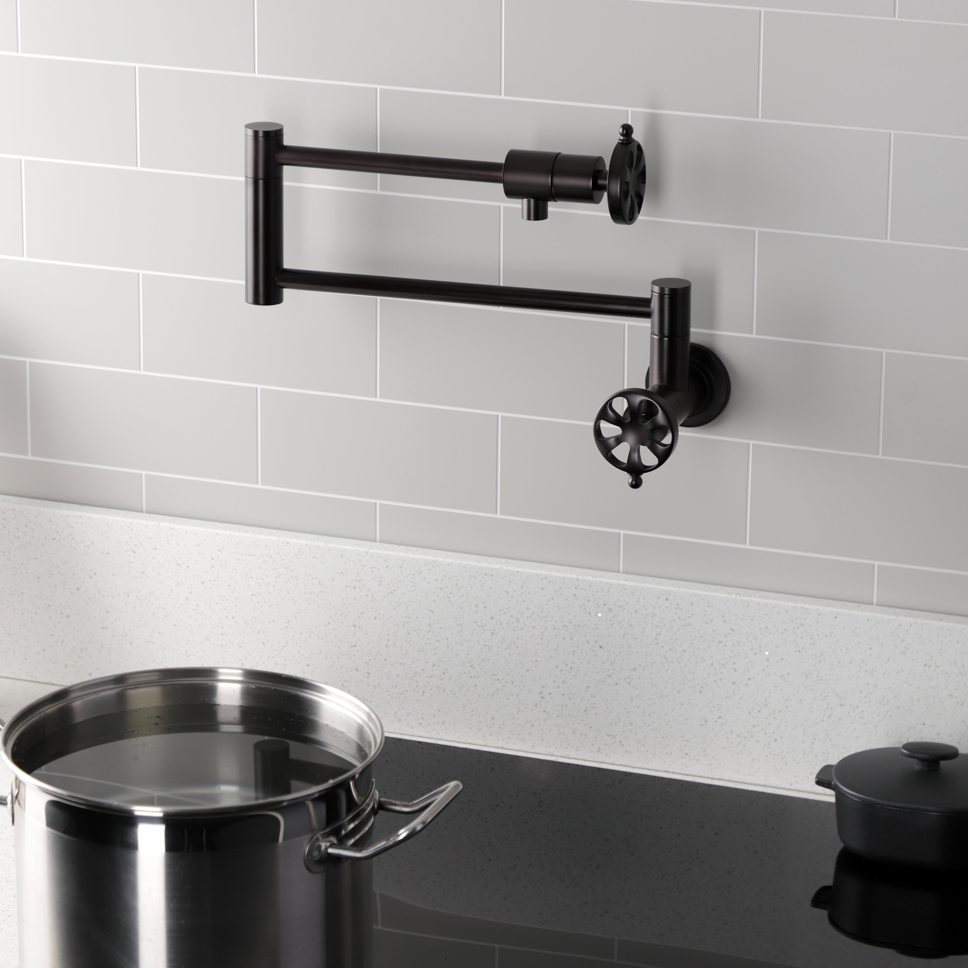 Kingston Brass KS4103RX Belknap Wall Mount Pot Filler Faucet, Antique Brass with foldable swing arms and pot.