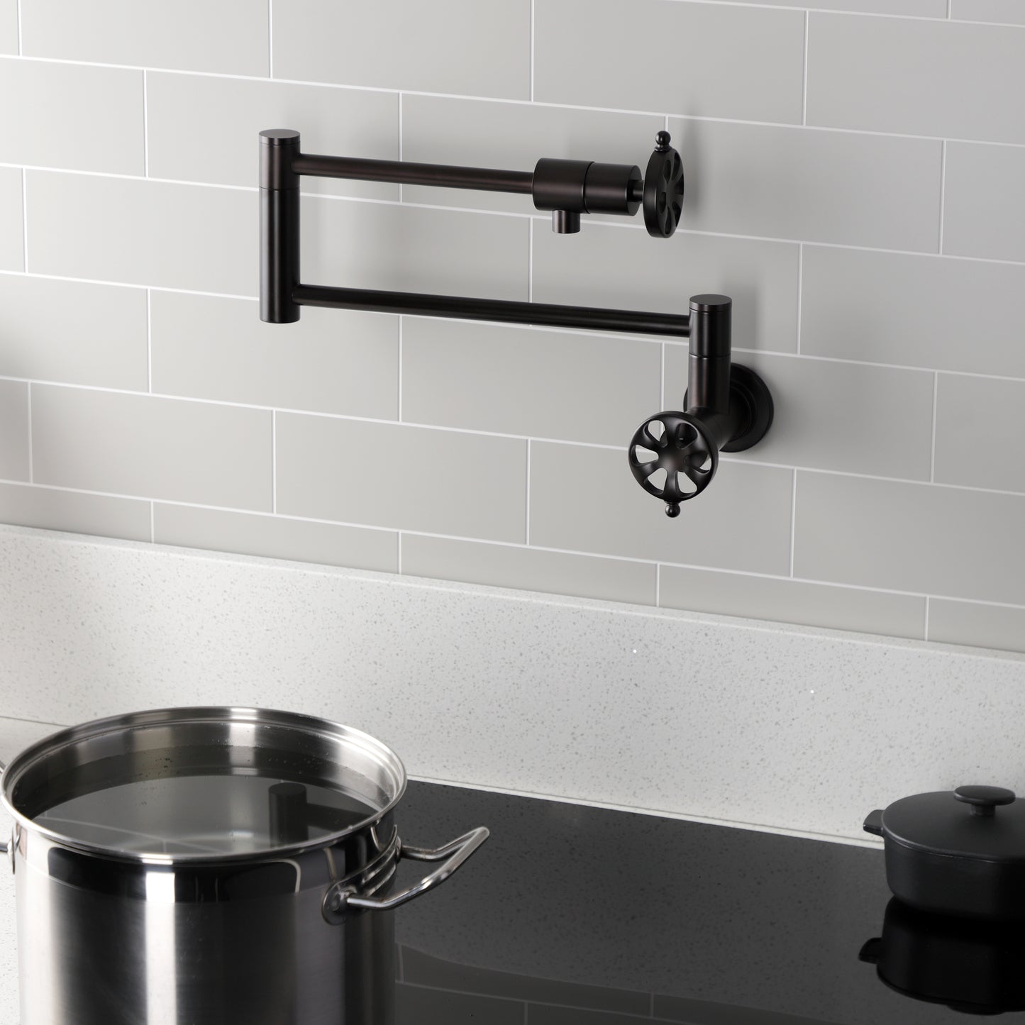 Kingston Brass KS4103RX Belknap Wall Mount Pot Filler Faucet, Antique Brass with foldable swing arms and pot.