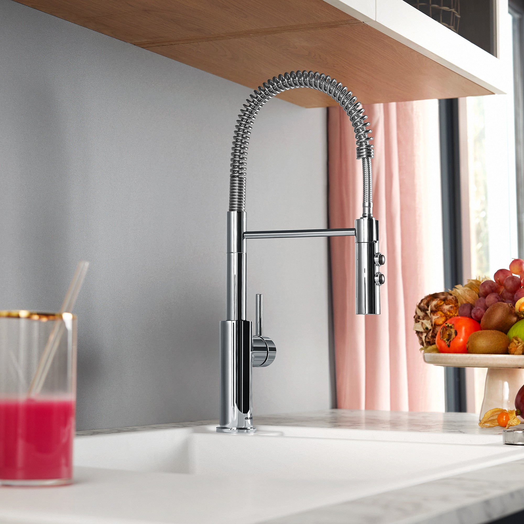 BLANCO Catris Semi-Pro Pull-Down Dual-Spray Kitchen Faucet showcasing spring-coil design in modern kitchen setting.