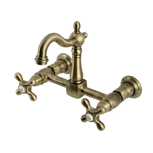 Kingston KS2443AX Heritage Two-Handle Wall Mount Bridge Kitchen Faucet, Antique Brass with classic cross handles.