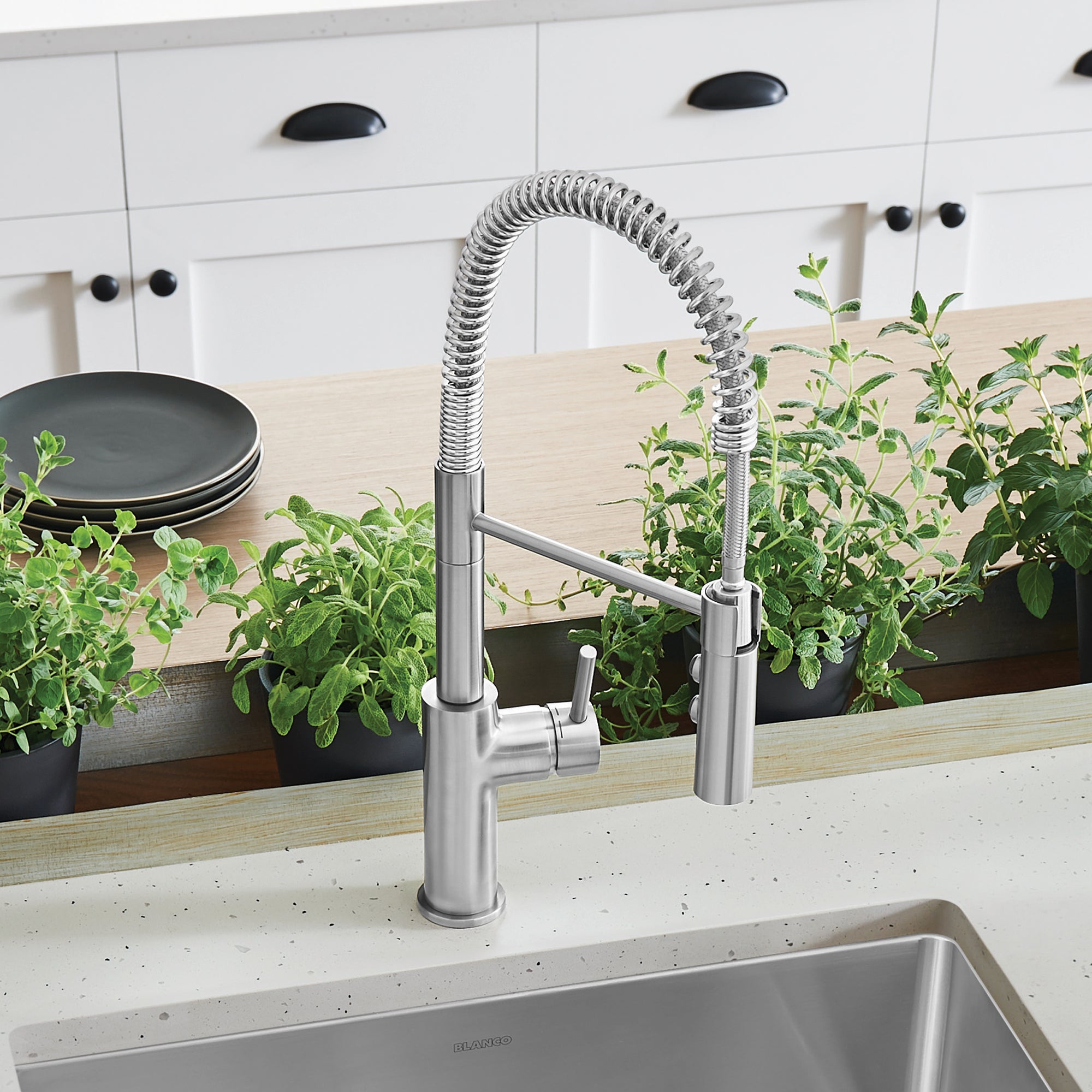 BLANCO Catris Semi-Pro Pull-Down Dual-Spray Kitchen Faucet featuring spring-coil design in a modern kitchen setting.