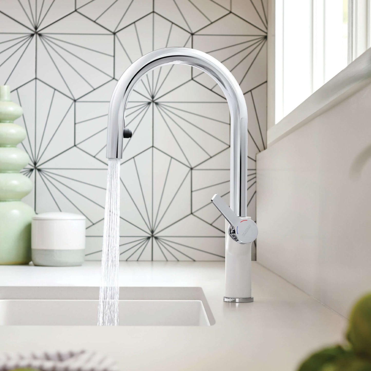 BLANCO Urbena Pull-Down Dual-Spray Kitchen Faucet in modern kitchen with sleek design and geometric tile backsplash.