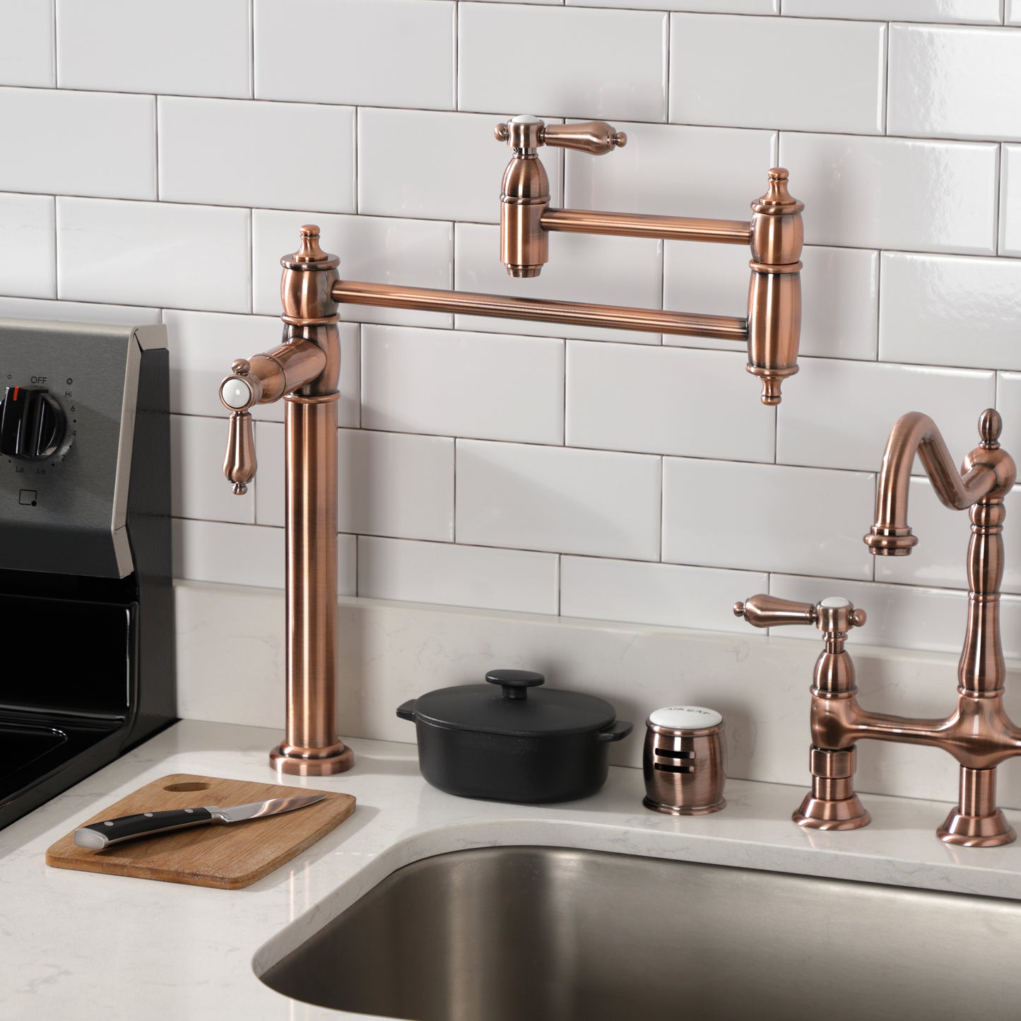 Kingston Brass KS3703BAL Heirloom Deck Mount Pot Filler Faucet, Antique Brass showcased on a kitchen countertop.