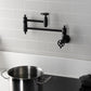 Kingston Brass KS3103CG Fuller Wall Mount Pot Filler Faucet, Antique Brass in a modern kitchen setting.