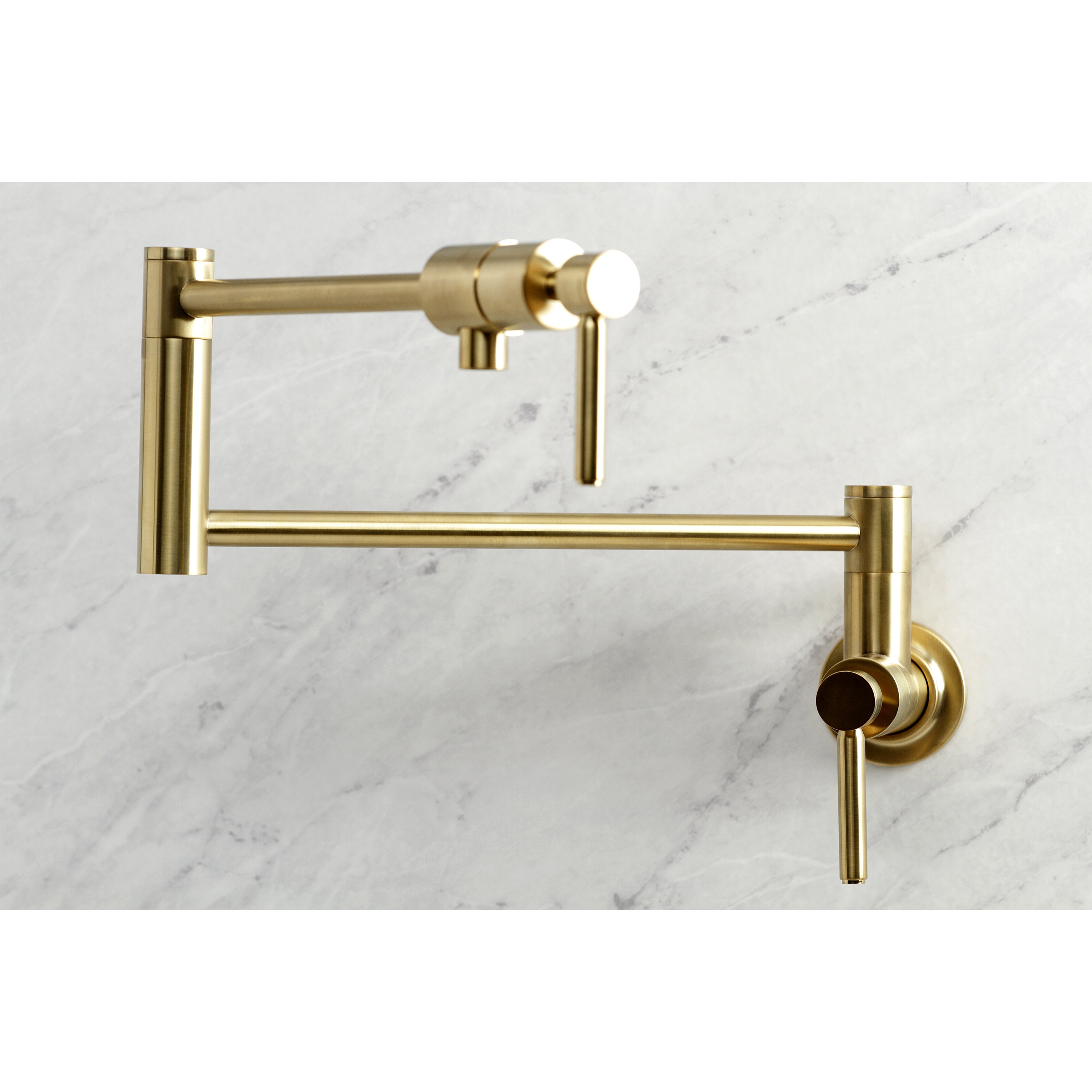Kingston Brass KS4103DL Concord Wall Mount Pot Filler Faucet, Antique Brass on marble background.