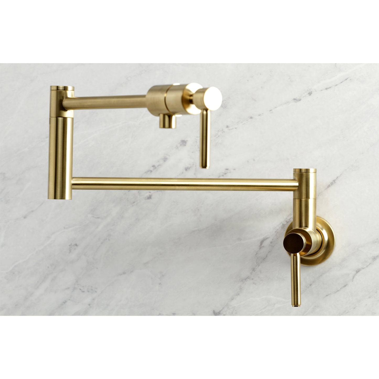Kingston Brass KS4103DL Concord Wall Mount Pot Filler Faucet, Antique Brass on marble background.