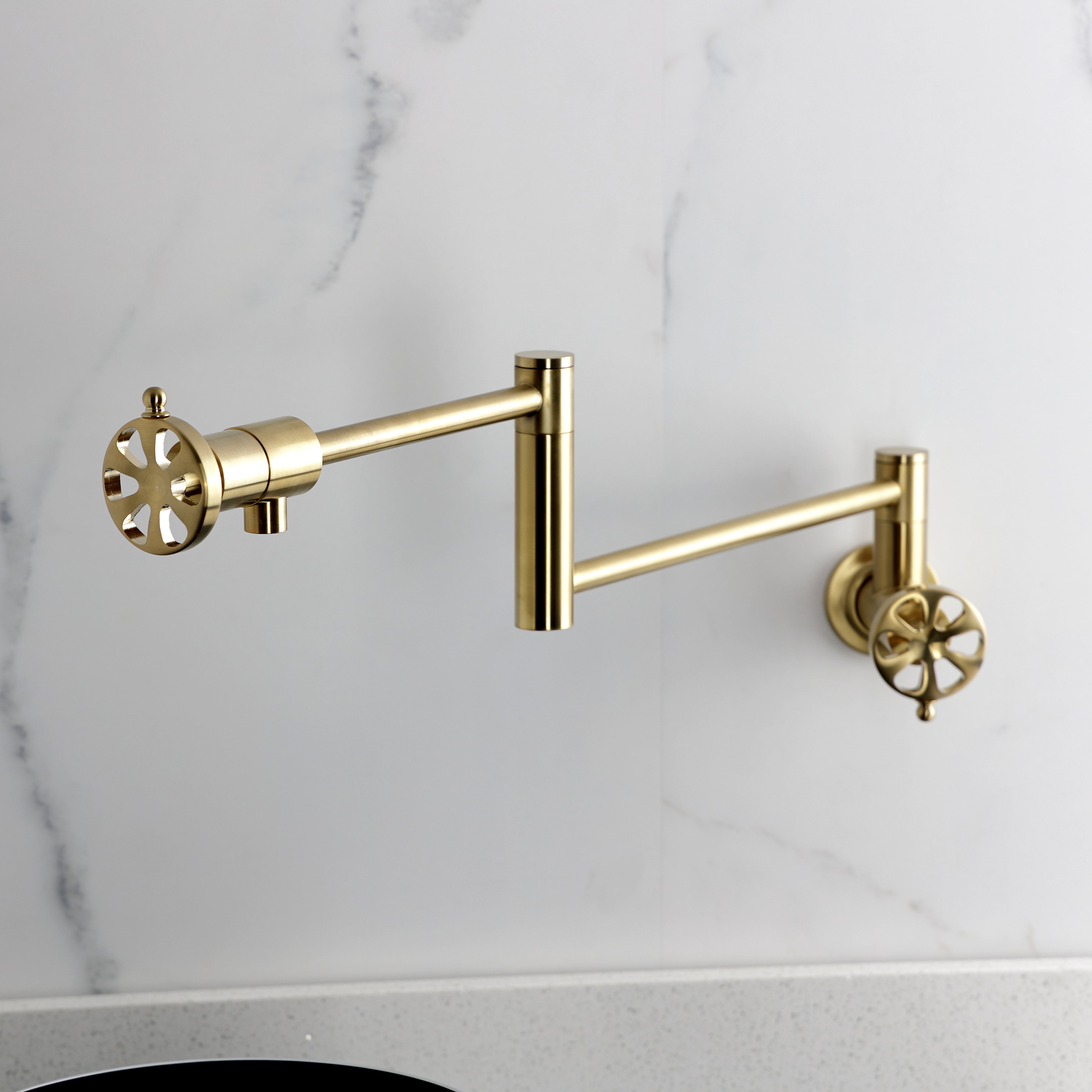 Kingston Brass KS4103RX Belknap Wall Mount Pot Filler Faucet, Antique Brass on a modern kitchen backsplash.