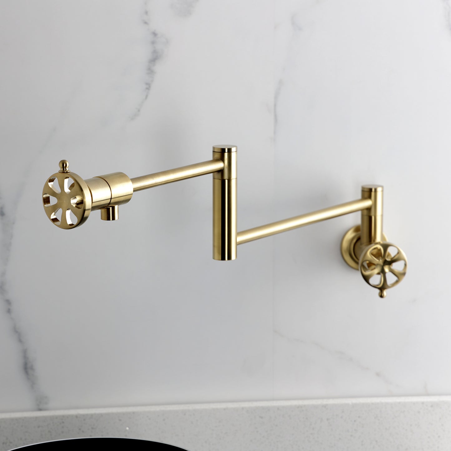 Kingston Brass KS4103RX Belknap Wall Mount Pot Filler Faucet, Antique Brass on a modern kitchen backsplash.