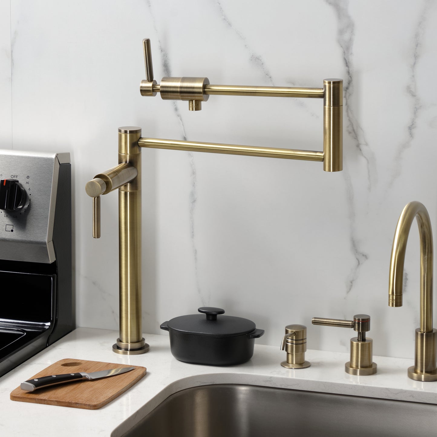 Kingston Brass KS4703DL Concord Deck Mount Pot Filler Faucet, Antique Brass shown in a modern kitchen setting.