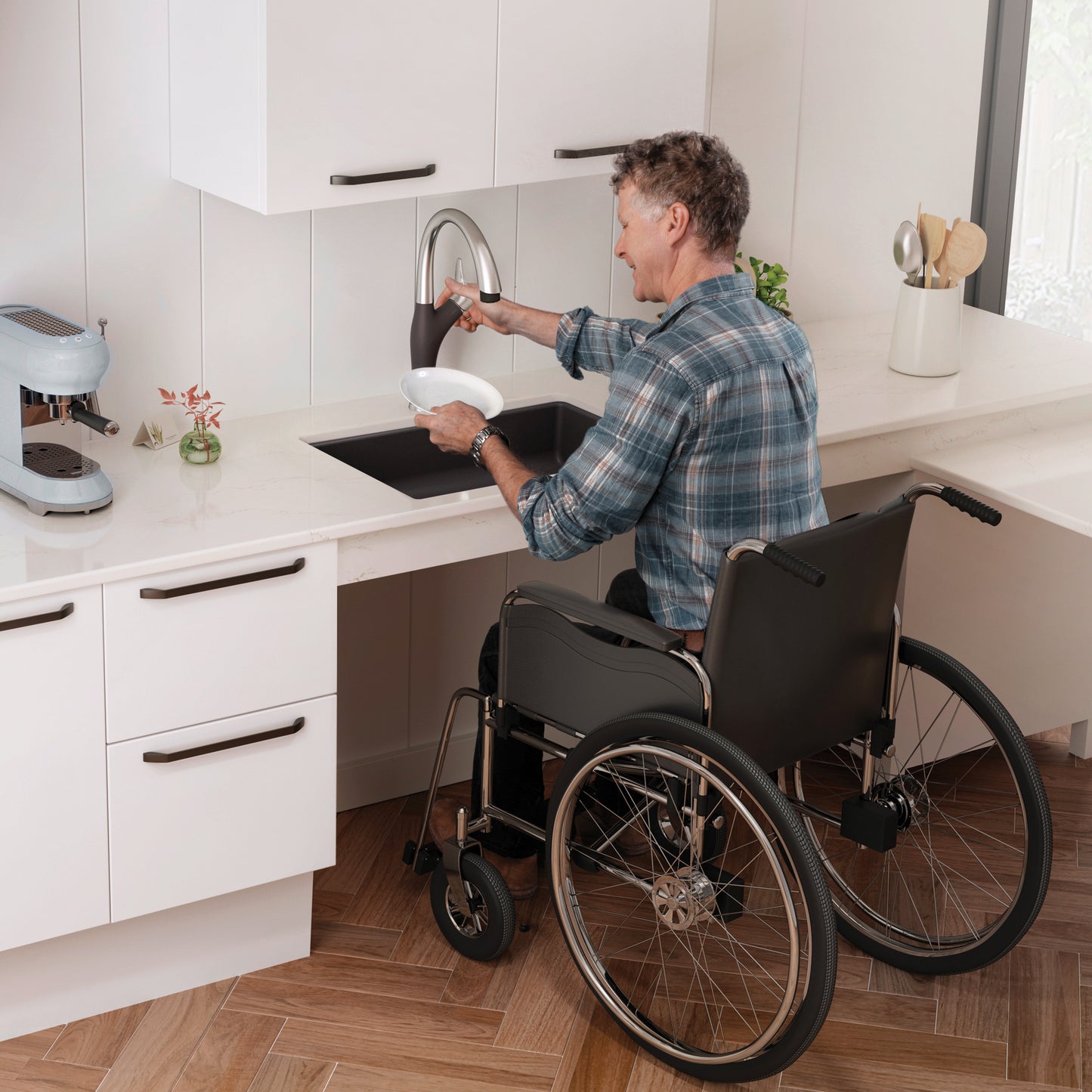 Man in wheelchair using BLANCO Precis SILGRANIT 25" ADA Single Bowl Undermount Kitchen Sink.