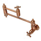 Kingston Brass KS3103AX Restoration Wall Mount Pot Filler Faucet, Antique Brass with foldable swing arms.