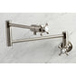 Kingston Brass KS4103BX Metropolitan Wall Mount Pot Filler Faucet, Antique Brass on marble background