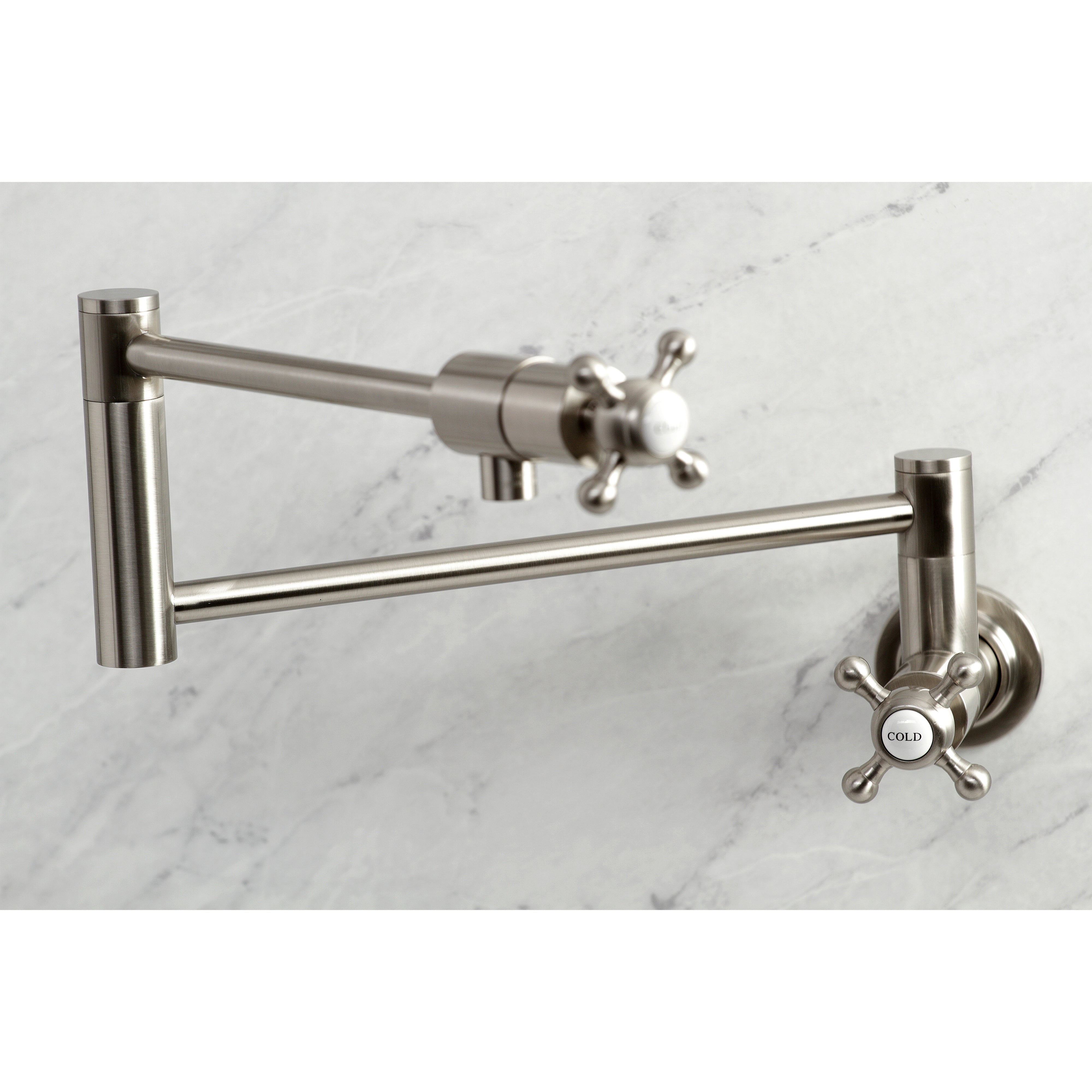 Kingston Brass KS4103BX Metropolitan Wall Mount Pot Filler Faucet, Antique Brass on marble background