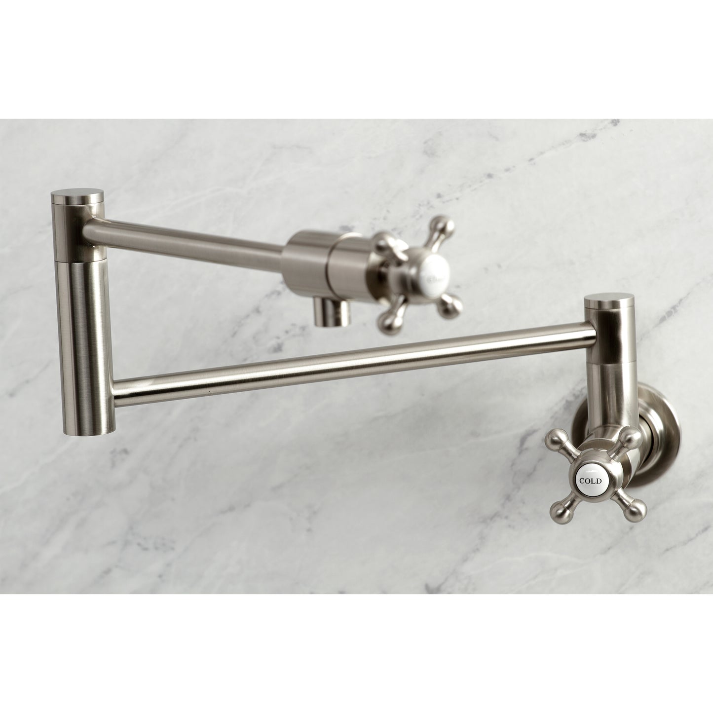Kingston Brass KS4103BX Metropolitan Wall Mount Pot Filler Faucet, Antique Brass on marble background