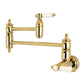 Kingston Brass KS3103BPL Bel-Air Wall Mount Pot Filler Faucet, Antique Brass with white porcelain levers and foldable swing arms.