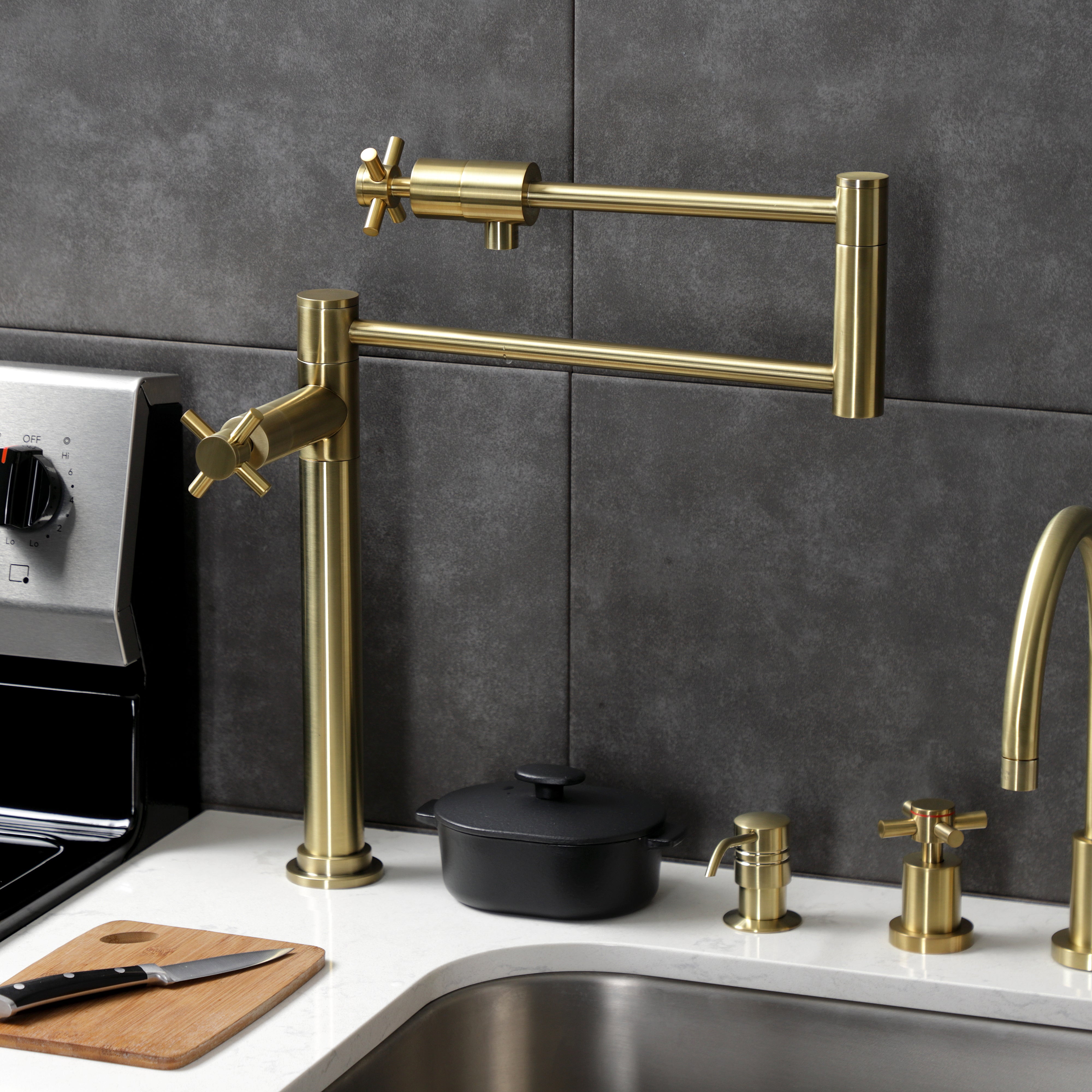 Kingston Brass KS4703DX Concord Deck Mount Pot Filler Faucet, Antique Brass in a stylish kitchen setting.