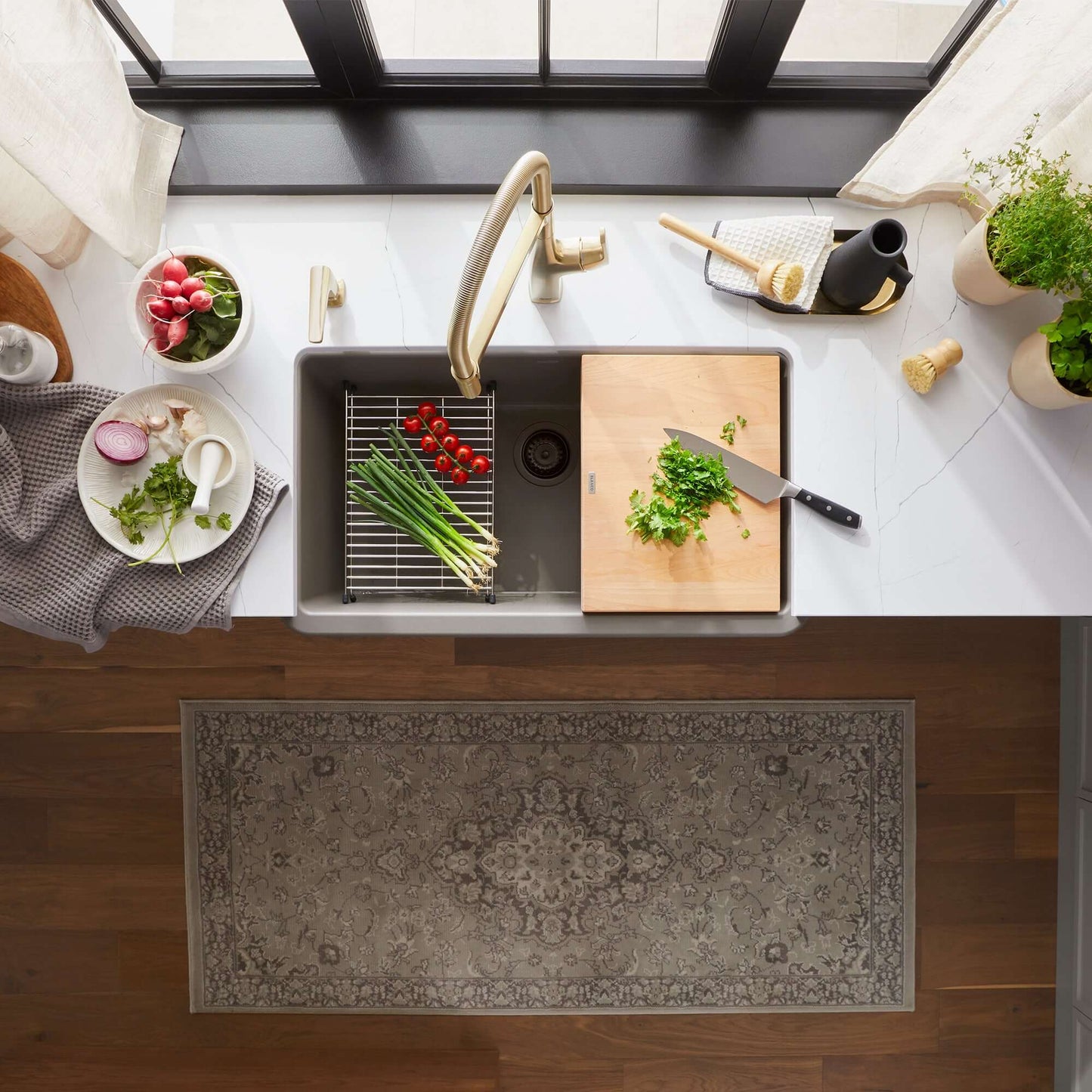 BLANCO Ikon SILGRANIT 33" Single Bowl Apron-Front Farmhouse Sink with vegetables on cutting board.