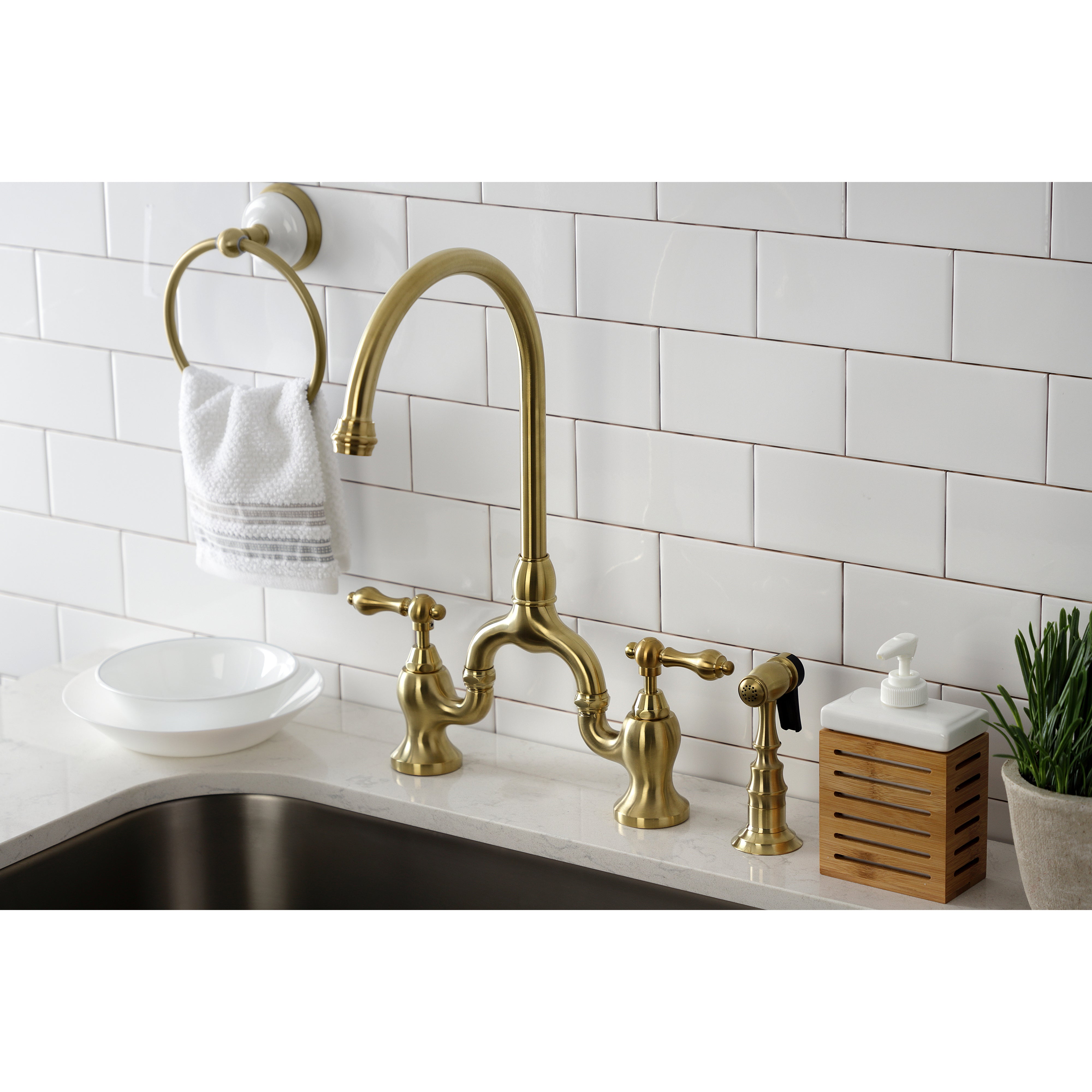Kingston KS7793ALBS English Country Bridge Kitchen Faucet with Brass Sprayer, Antique Brass installed in kitchen